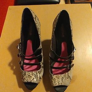 Snakeskin and patent pumps